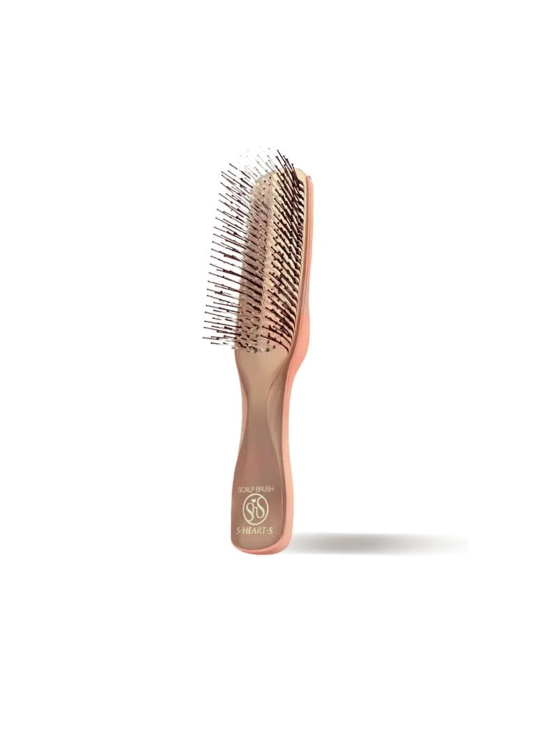 La Scalp Brush est une brosse à picots qui stimule la microcirculation capillaire.