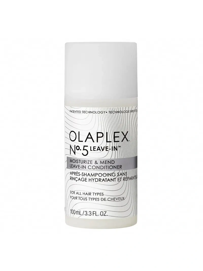 Flacon blanc Olaplex N°5 Leave-In, soin réparateur sans rinçage pour cheveux abîmés. Technologie Bond Building pour une hydratation intense et une protection thermique. Résultats visibles dès la première utilisation